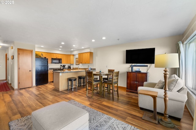 living room with wood-type flooring