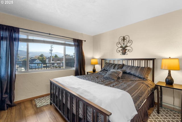 bedroom featuring hardwood / wood-style floors