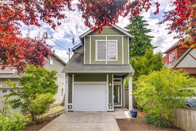 4338 NE 76th Ave, Portland, OR 97218 - view of front of property featuring roof with shingles, a garage, and driveway