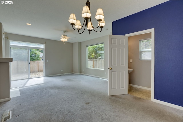 4338 NE 76th Ave, Portland, OR 97218 - carpeted empty room with a chandelier, plenty of natural light, and ceiling fan