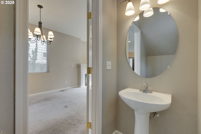 4338 NE 76th Ave, Portland, OR 97218 - bathroom with a chandelier and baseboards