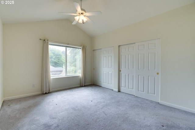 4338 NE 76th Ave, Portland, OR 97218 - unfurnished bedroom featuring multiple closets, carpet flooring, lofted ceiling, and a ceiling fan