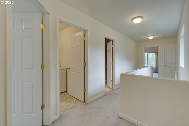 4338 NE 76th Ave, Portland, OR 97218 - hallway featuring light carpet and washer / clothes dryer