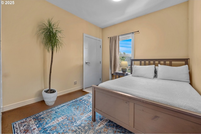 bedroom featuring baseboards