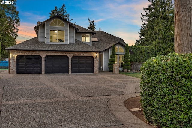 view of front of property with a garage