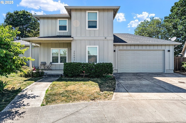 25092 Amber Ct, Veneta, OR 97487 - view of front of property with board and batten siding, covered porch, concrete driveway, and an attached garage