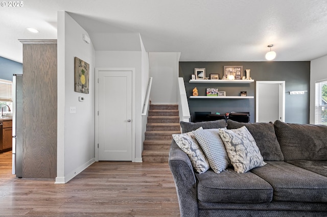 25092 Amber Ct, Veneta, OR 97487 - living room with wood finished floors, stairway, and baseboards