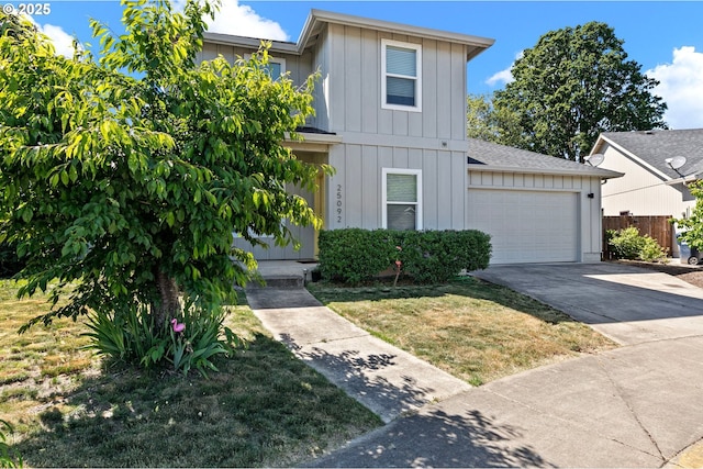 25092 Amber Ct, Veneta, OR 97487 - traditional home featuring board and batten siding, concrete driveway, a garage, and a front yard
