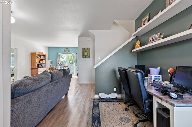 25092 Amber Ct, Veneta, OR 97487 - home office featuring wood finished floors, a textured ceiling, and baseboards
