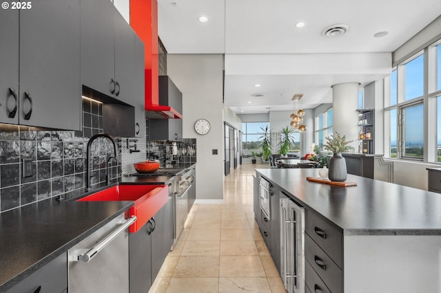 700 Washington St Unit 1125, Vancouver, WA 98660 - kitchen with dark countertops, stainless steel dishwasher, decorative backsplash, healthy amount of natural light, and recessed lighting