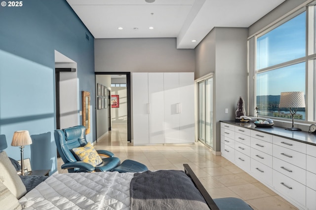 700 Washington St Unit 1125, Vancouver, WA 98660 - bedroom with light tile patterned flooring, recessed lighting, and a high ceiling