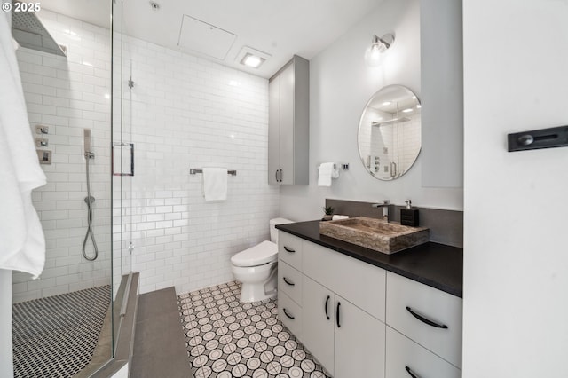 700 Washington St Unit 1125, Vancouver, WA 98660 - bathroom featuring vanity, a stall shower, and tile patterned flooring