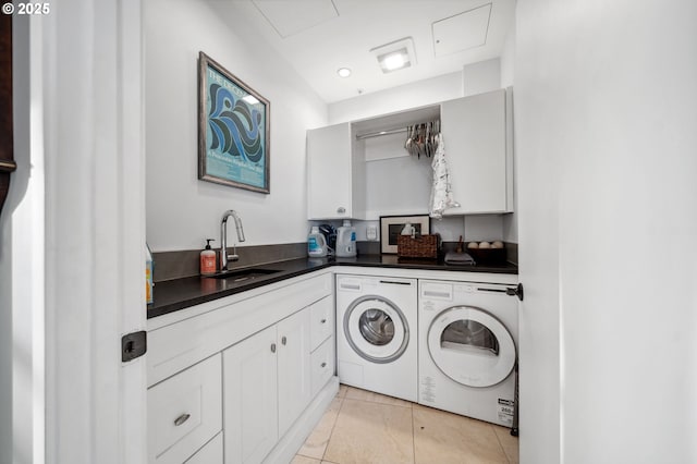 700 Washington St Unit 1125, Vancouver, WA 98660 - laundry room with washer and clothes dryer, cabinet space, and light tile patterned floors