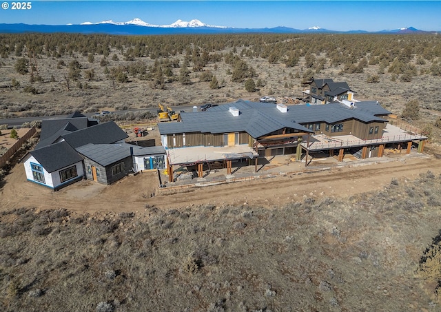 aerial view with a mountain view and view of desert
