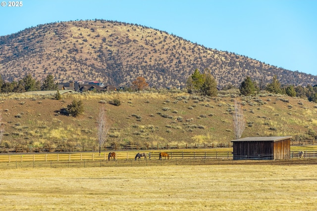 view of mountain feature with a rural view