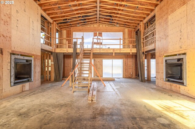 17097 SW Lago Vista Dr, Powell Butte, OR 97753 - unfurnished living room featuring high vaulted ceiling