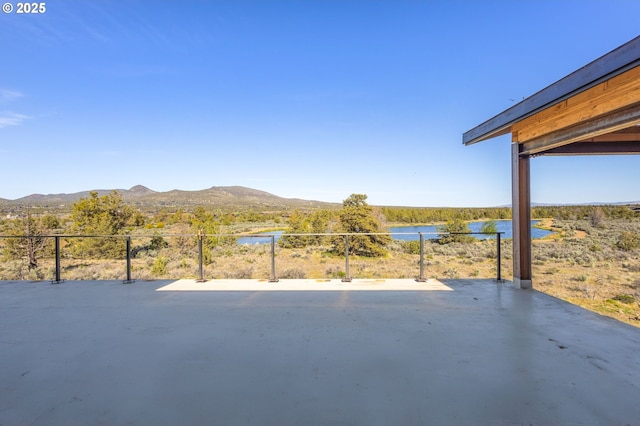 17097 SW Lago Vista Dr, Powell Butte, OR 97753 - view of patio / terrace with fence and a water and mountain view