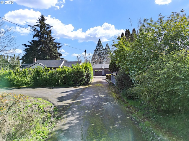 view of road with aphalt driveway