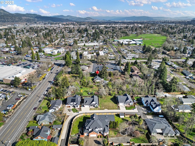 birds eye view of property with a residential view and a mountain view