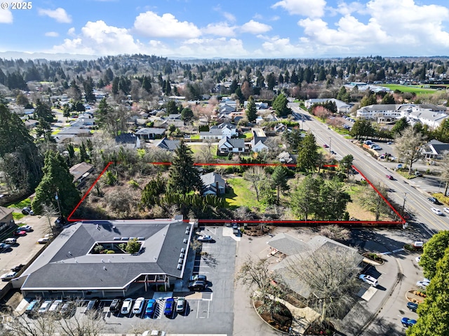 birds eye view of property with a residential view