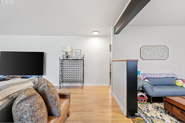 interior space featuring baseboards and wood finished floors