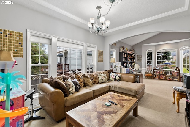 3303 NE 141st St, Vancouver, WA 98686 - living room with light colored carpet, a chandelier, arched walkways, crown molding, and healthy amount of natural light