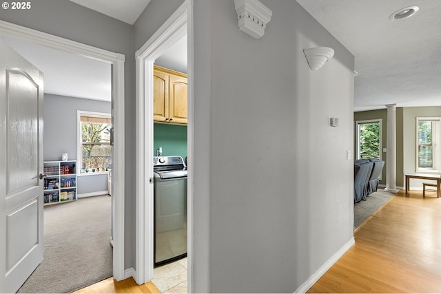 3303 NE 141st St, Vancouver, WA 98686 - hallway featuring washer / clothes dryer, ornate columns, healthy amount of natural light, and baseboards