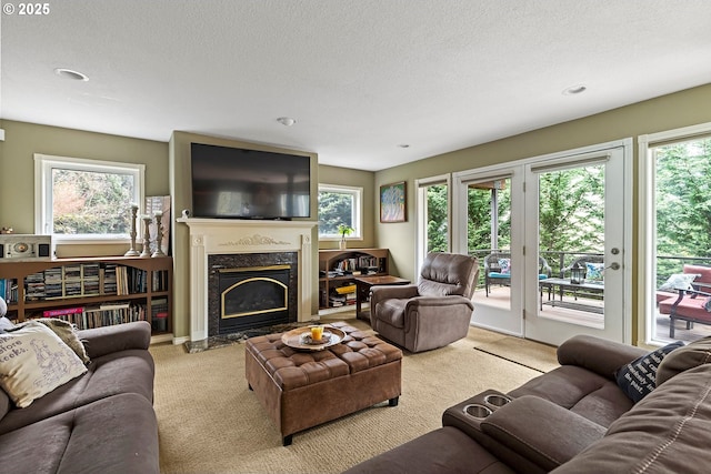 3303 NE 141st St, Vancouver, WA 98686 - living room with carpet flooring, a fireplace, a textured ceiling, and recessed lighting