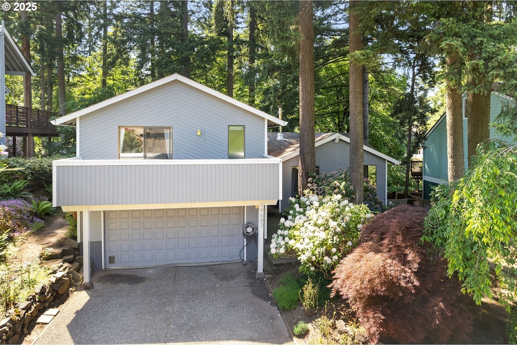 19683 Sun Cir, West Linn, OR 97068 - view of front of home with an attached garage and driveway