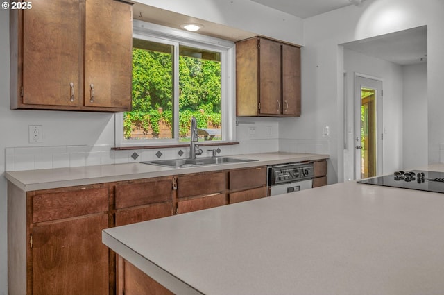 32813 NW Peak Rd, Scappoose, OR 97056 - kitchen with a sink, light countertops, healthy amount of natural light, and black electric cooktop
