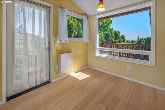 32813 NW Peak Rd, Scappoose, OR 97056 - empty room featuring wood finished floors, baseboards, and vaulted ceiling