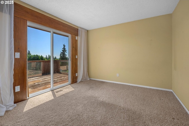 32813 NW Peak Rd, Scappoose, OR 97056 - unfurnished room with carpet, baseboards, and a textured ceiling