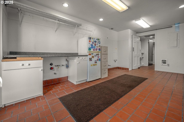 32813 NW Peak Rd, Scappoose, OR 97056 - washroom featuring baseboards, heating unit, recessed lighting, and electric panel