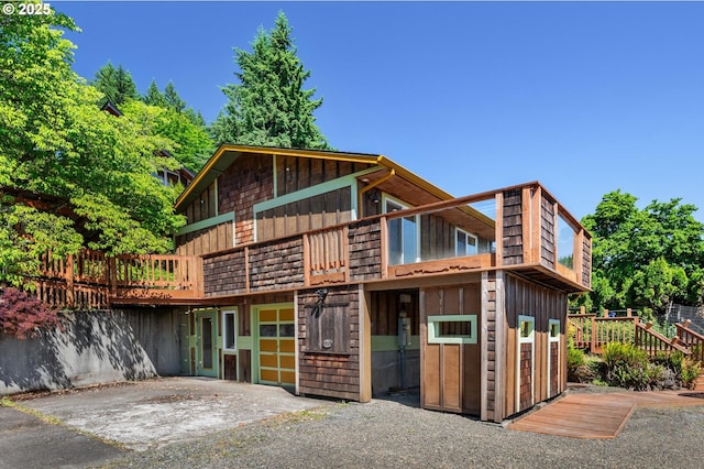 32813 NW Peak Rd, Scappoose, OR 97056 - view of front of home with board and batten siding and a deck