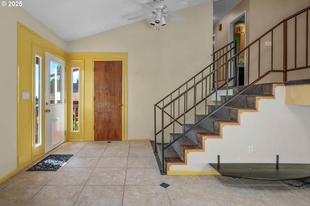 32813 NW Peak Rd, Scappoose, OR 97056 - tiled entryway with stairway, a ceiling fan, lofted ceiling, and baseboards