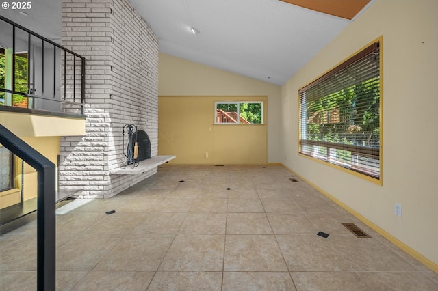 32813 NW Peak Rd, Scappoose, OR 97056 - unfurnished living room featuring lofted ceiling and tile patterned flooring