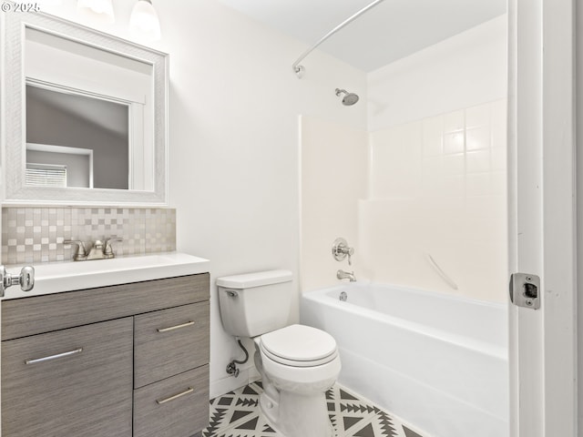 full bathroom with tile patterned floors, toilet, tasteful backsplash, shower / bathtub combination, and vanity