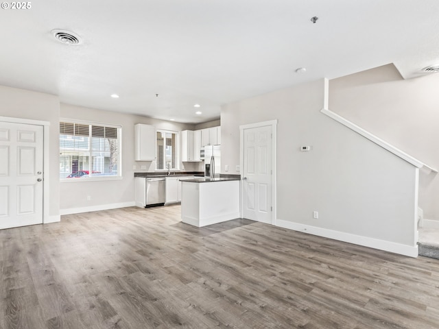 unfurnished living room featuring light hardwood / wood-style flooring