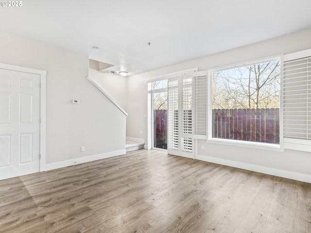 unfurnished living room featuring hardwood / wood-style floors