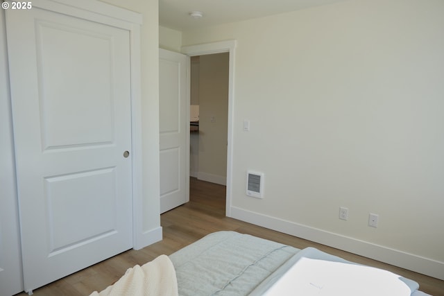 46412 Lyons Mill City Dr, Lyons, OR 97358 - bedroom with baseboards, wood finished floors, and visible vents