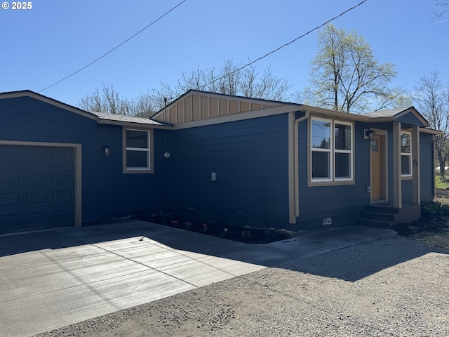 46412 Lyons Mill City Dr, Lyons, OR 97358 - view of property exterior featuring driveway, board and batten siding, crawl space, and a garage