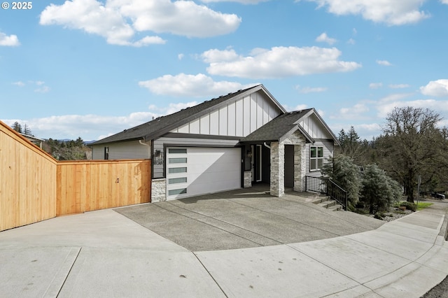 1730 N 12th St, Washougal, WA 98671 - view of front facade with stone siding, board and batten siding, concrete driveway, an attached garage, and a shingled roof