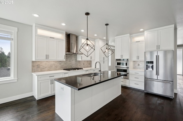 1730 N 12th St, Washougal, WA 98671 - kitchen featuring stainless steel appliances, wall chimney exhaust hood, a sink, backsplash, and dark wood finished floors
