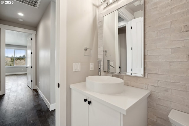 1730 N 12th St, Washougal, WA 98671 - bathroom with wood finished floors, vanity, toilet, and baseboards