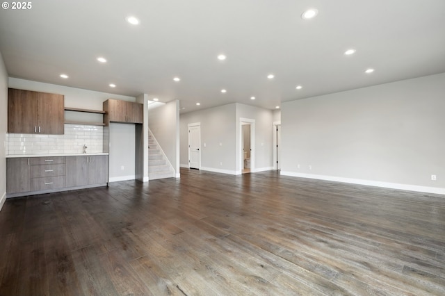 1730 N 12th St, Washougal, WA 98671 - unfurnished living room featuring dark wood-style flooring, stairs, recessed lighting, and baseboards