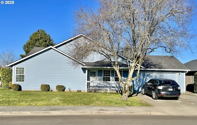 view of front of home featuring a garage, a front yard, and a porch