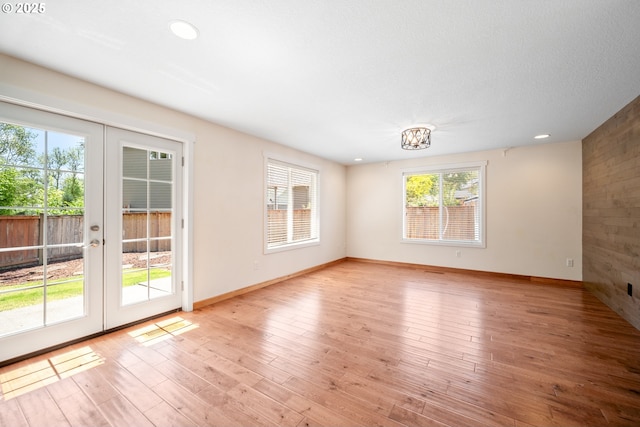 1602 NE 16th Ct, Battle Ground, WA 98604 - unfurnished room with french doors, baseboards, light wood-style flooring, and recessed lighting