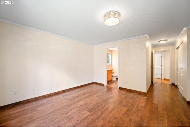 1602 NE 16th Ct, Battle Ground, WA 98604 - unfurnished room featuring crown molding, dark wood-style flooring, and baseboards