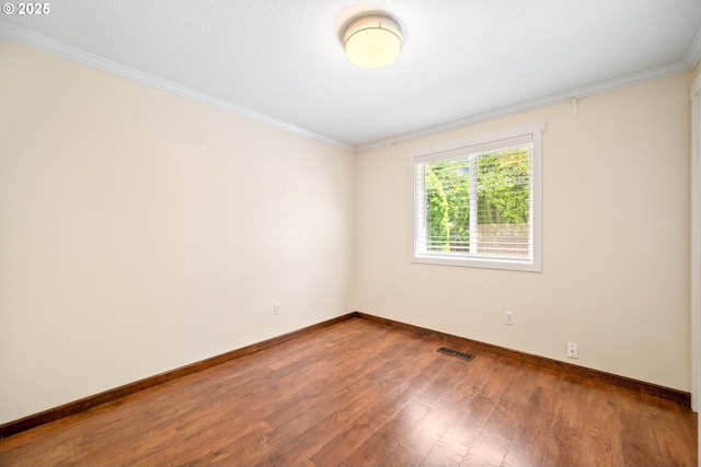 1602 NE 16th Ct, Battle Ground, WA 98604 - empty room featuring wood finished floors, baseboards, and crown molding