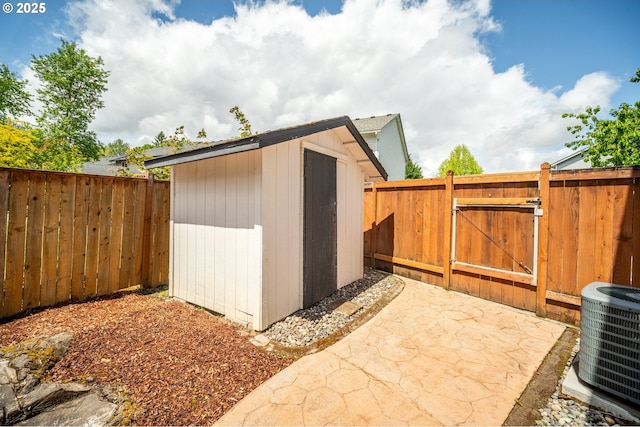 1602 NE 16th Ct, Battle Ground, WA 98604 - view of shed with central AC, a fenced backyard, and a gate